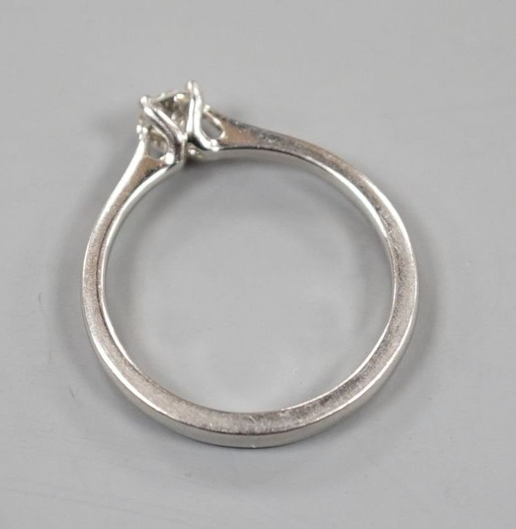 A modern platinum and solitaire diamond ring, size Q/R, gross weight 5.4 grams